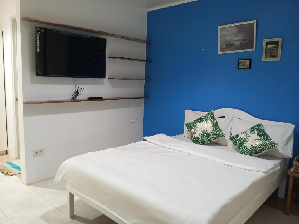 Postel nebo postele na pokoji v ubytování LALUNA COTTAGES