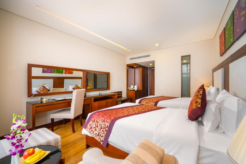 Letto o letti in una camera di Minh Toan Galaxy Hotel