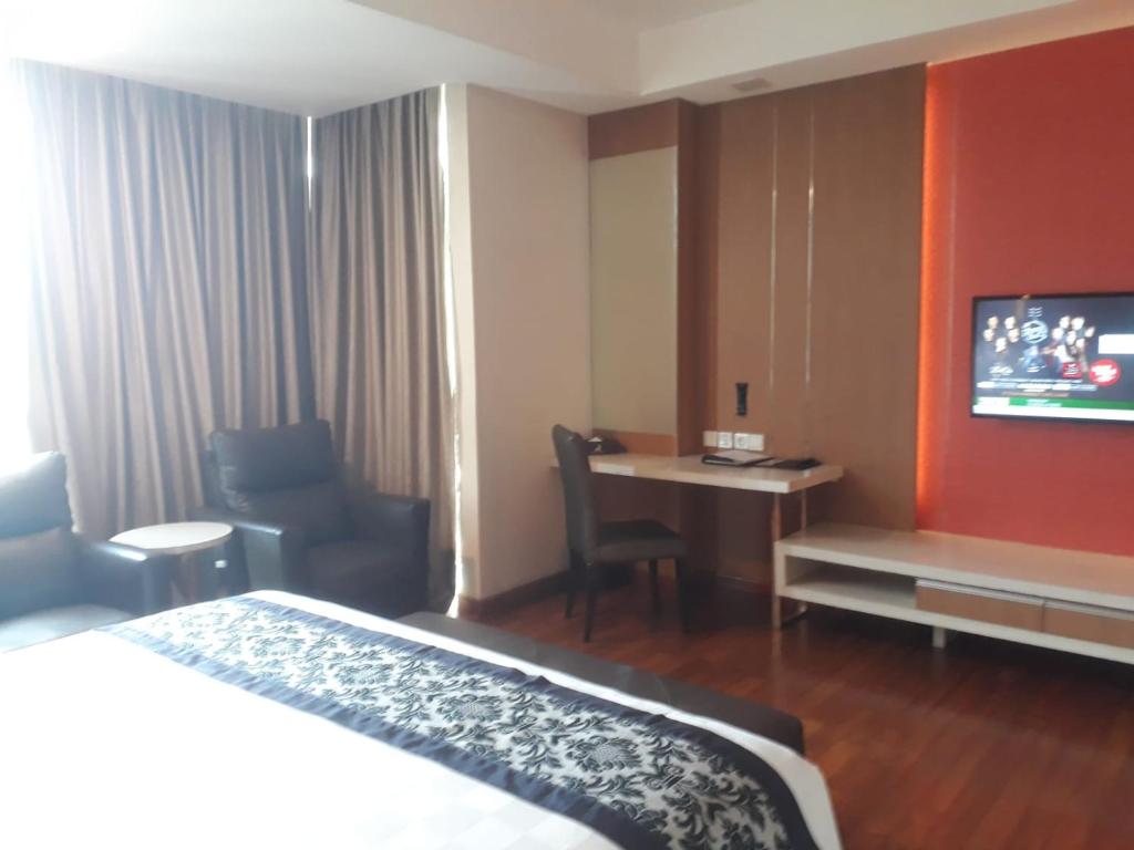 Postel nebo postele na pokoji v ubytování Nagoya Hill Hotel Batam