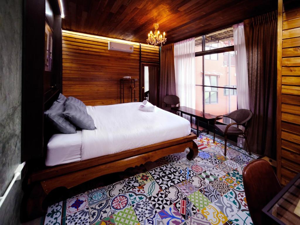 Cama ou camas em um quarto em Photohostel