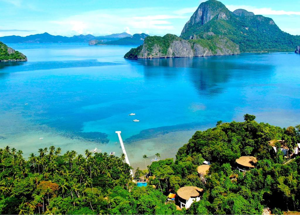 a view of a large body of water with mountains at LIHIM RESORTS in El Nido