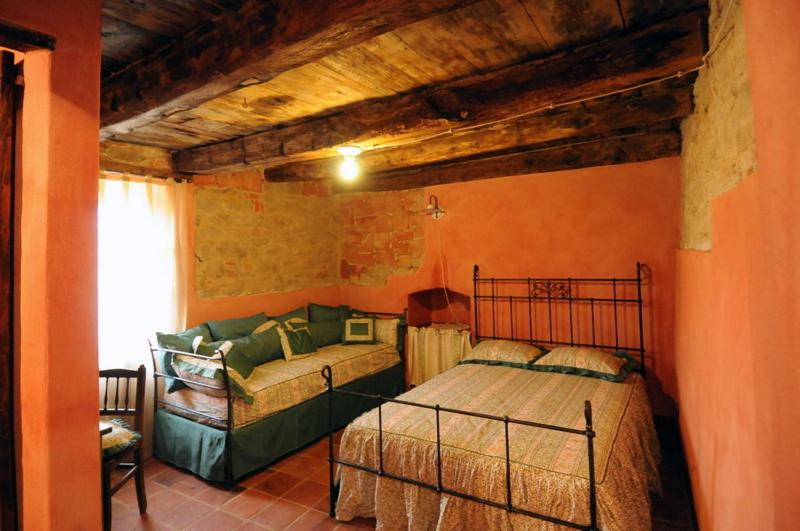 Łóżko lub łóżka w pokoju w obiekcie Dimora Storico Romantica Il Sole E La Luna