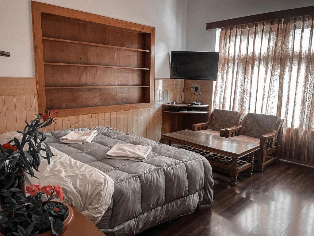 Postel nebo postele na pokoji v ubytování Hotel shaynam