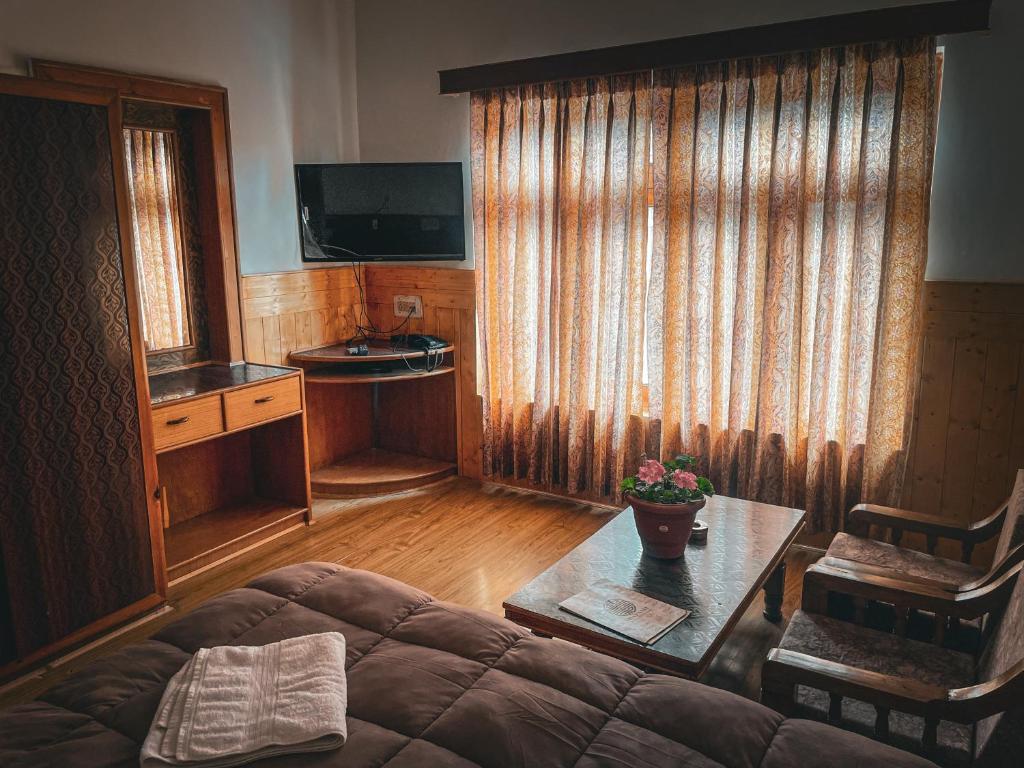 TV a/nebo společenská místnost v ubytování Hotel shaynam