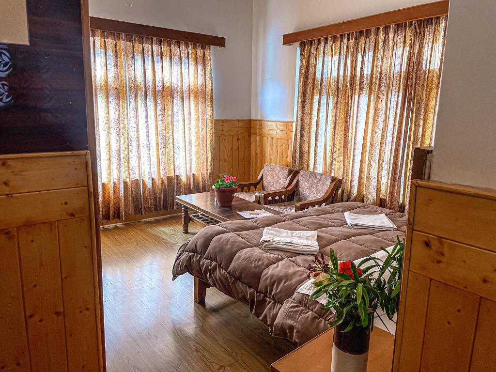 Postel nebo postele na pokoji v ubytování Hotel shaynam