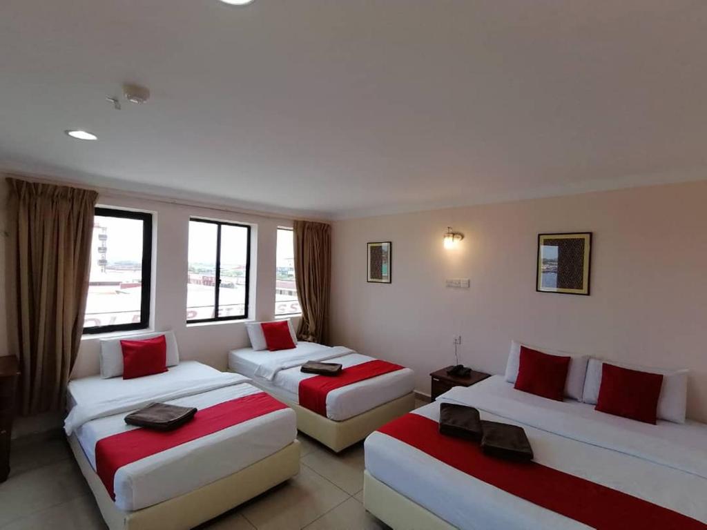 Postel nebo postele na pokoji v ubytování HOTEL PANTAI VIEW