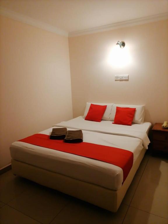 Postel nebo postele na pokoji v ubytování HOTEL PANTAI VIEW