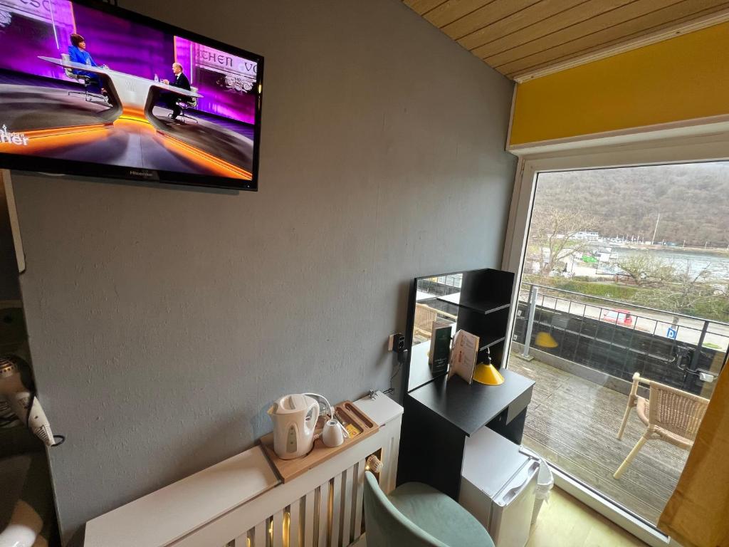 TV a/nebo společenská místnost v ubytování Green Seeblick Hotel am See