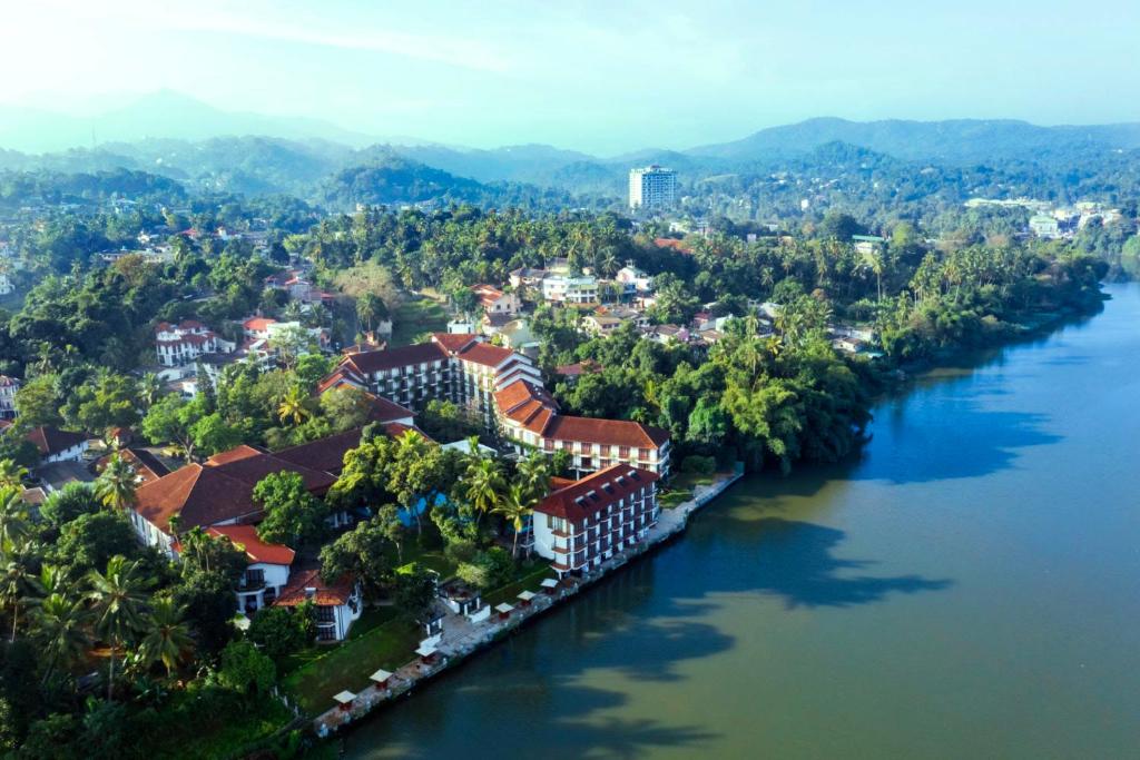 an aerial view of a town next to a river at Mahaweli Reach Hotel in Kandy