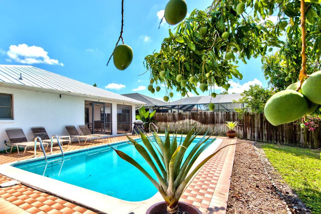 a swimming pool in the backyard of a house at Avanti Vacation Rental in Naples