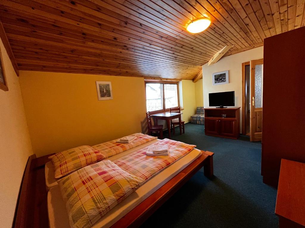 Postel nebo postele na pokoji v ubytování Penzión Mizuna
