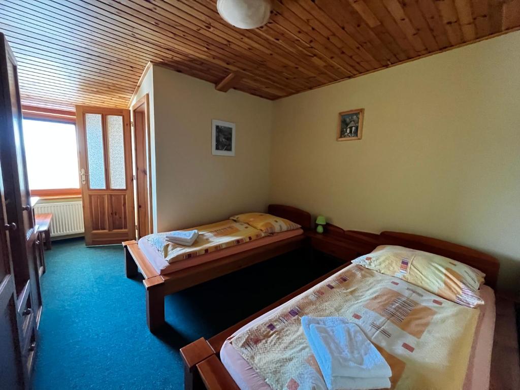 Postel nebo postele na pokoji v ubytování Penzión Mizuna