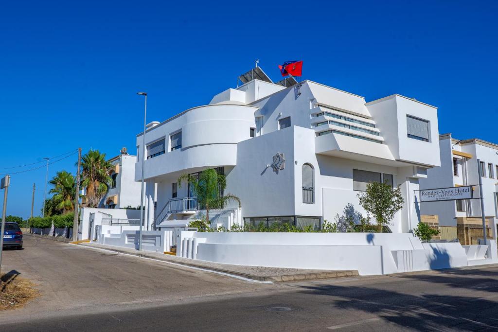 a white building on the side of a street at Al Rayyan - Affittacamere in Montesano Salentino