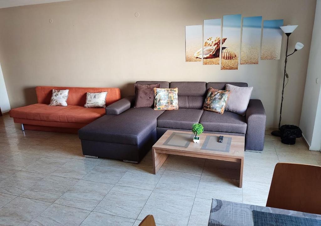 a living room with a couch and a coffee table at Charis Cozy Family apart at Sun Village Complex close to the Beach in Sunny Beach