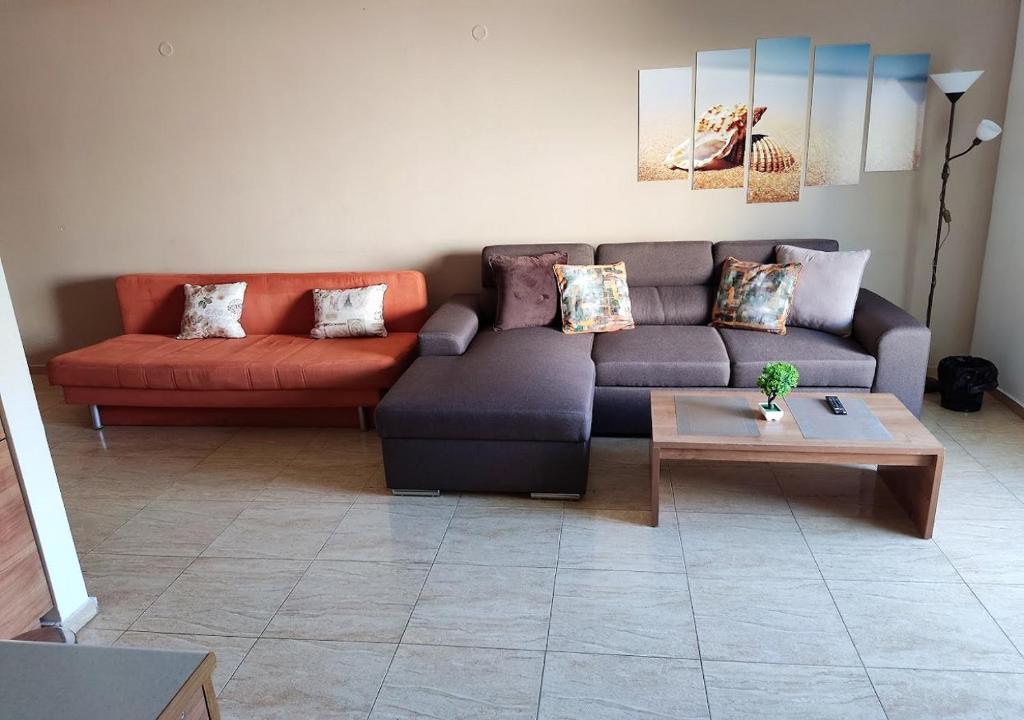 a living room with a couch and a coffee table at Charis Cozy Family apart at Sun Village Complex close to the Beach in Sunny Beach