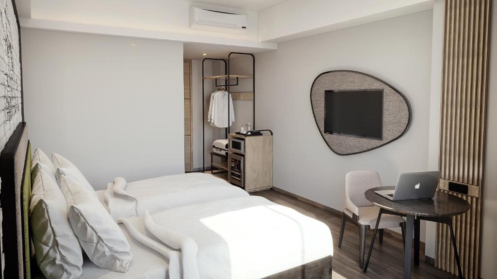 Postel nebo postele na pokoji v ubytování Luminor Hotel Padjadjaran Bogor by WH