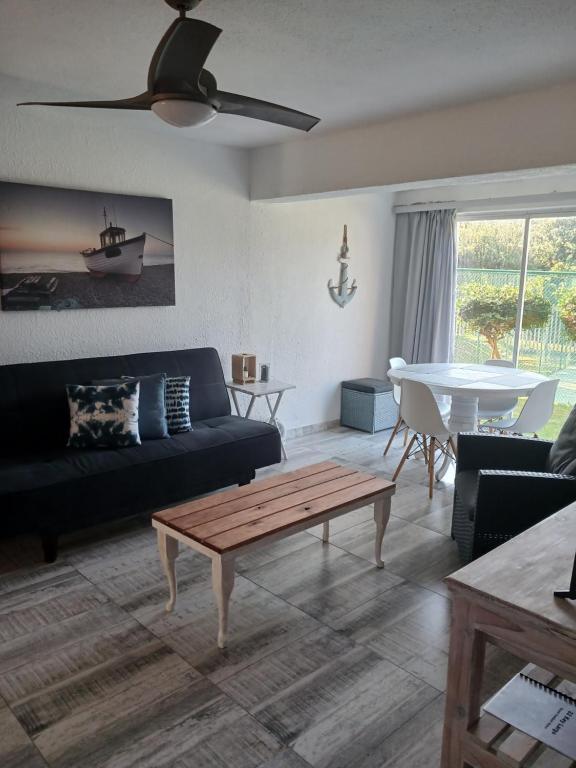 a living room with a couch and a table at 22 Key Largo in Kingsborough