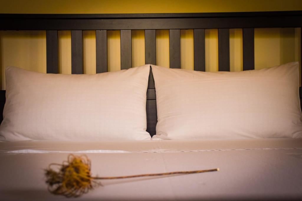 Säng eller sängar i ett rum på Dimora Arborea