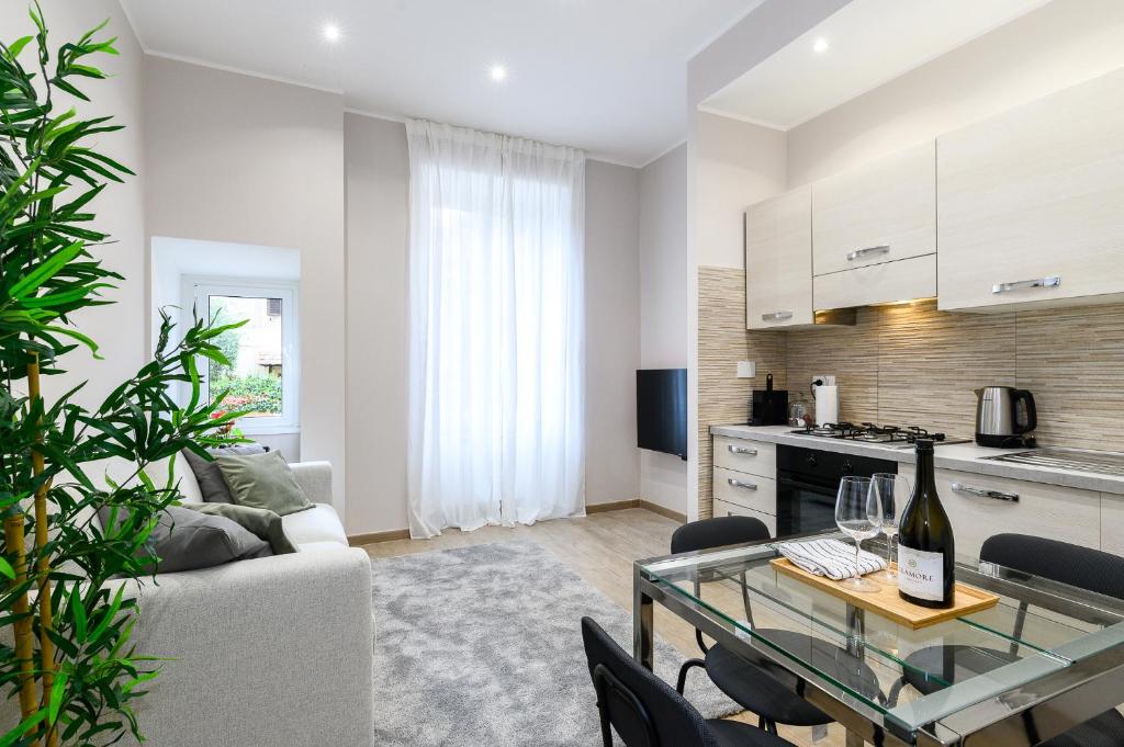 a living room with a couch and a table at Simply Perfect Apartment - NDP Rent in Rome