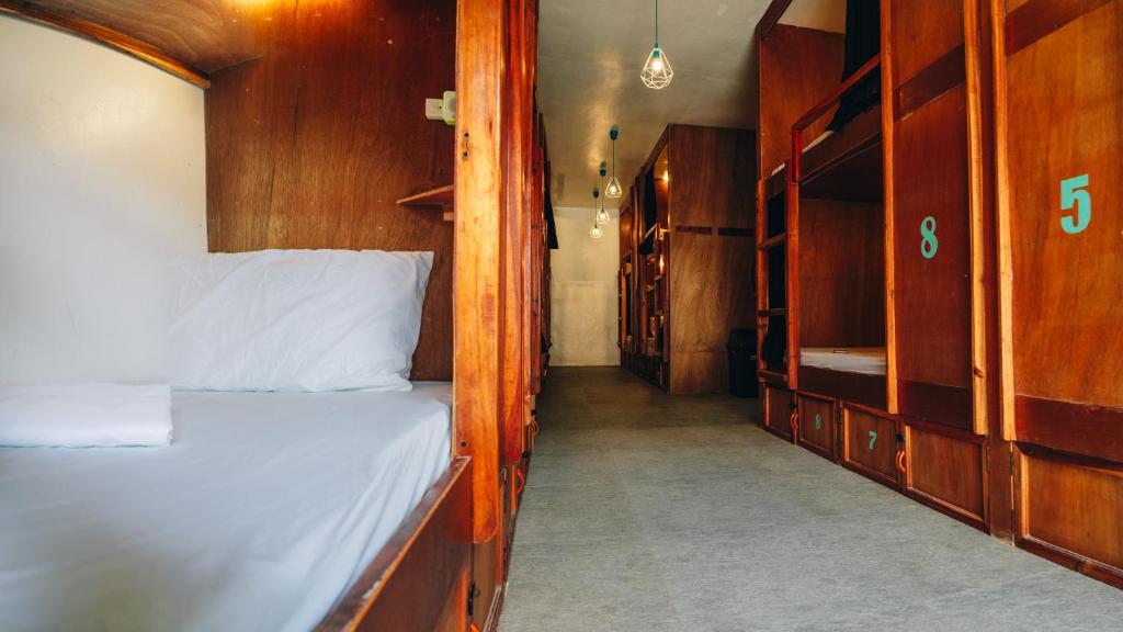 Una cama o camas en una habitación de My Green Hostel