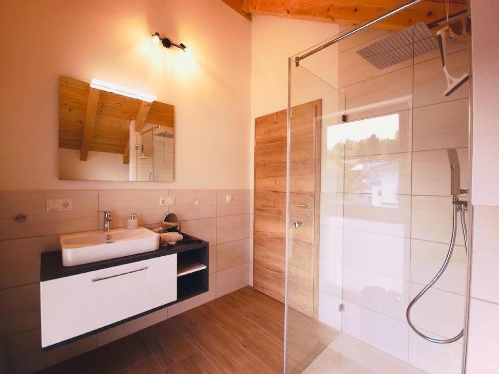 a bathroom with a sink and a shower at Ferienwohnungen Ebner in Bischofsmais