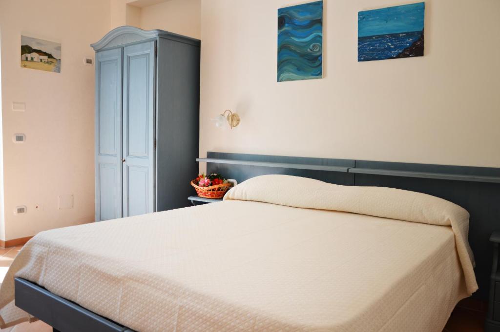 Ένα ή περισσότερα κρεβάτια σε δωμάτιο στο Agriturismo Terra Di Elea azienda agricola di Raimondo MIchela