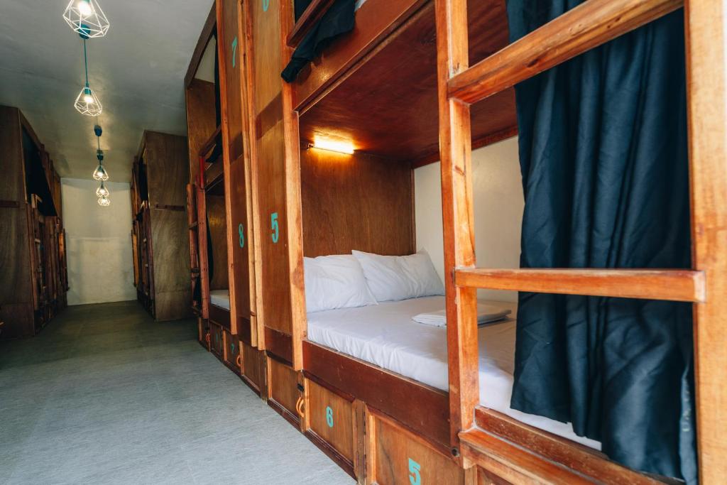 Una cama o camas en una habitación de My Green Hostel