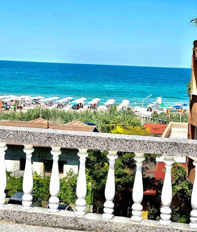 a balcony with a view of the beach and the ocean at hotel Yanis in Lozenets