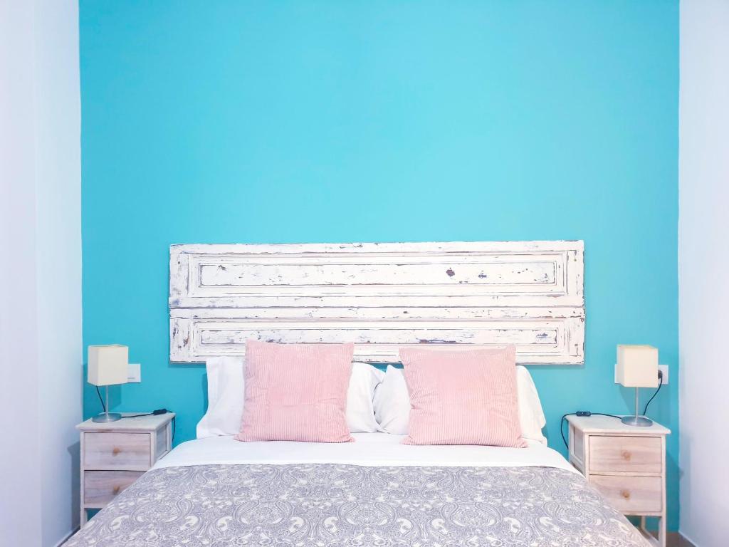Posteľ alebo postele v izbe v ubytovaní Triana Home Luxury