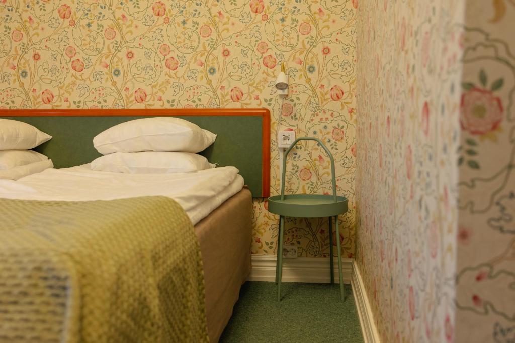 Postel nebo postele na pokoji v ubytování Hotel Lorensberg
