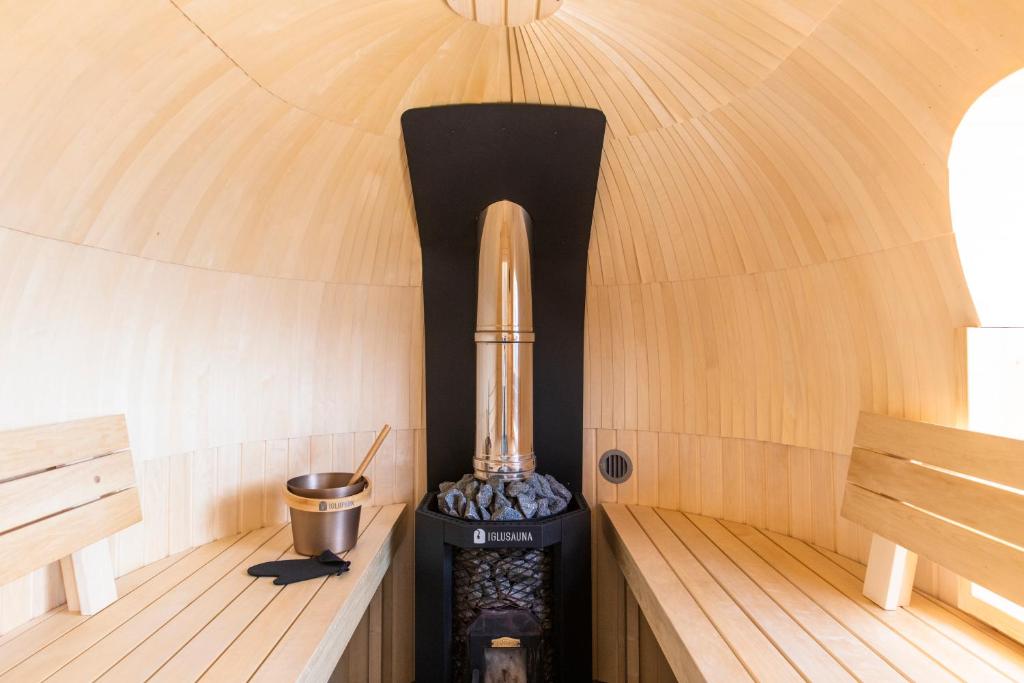 a inside of a yurt with a stove in it at Heiniku Home in Elbiku