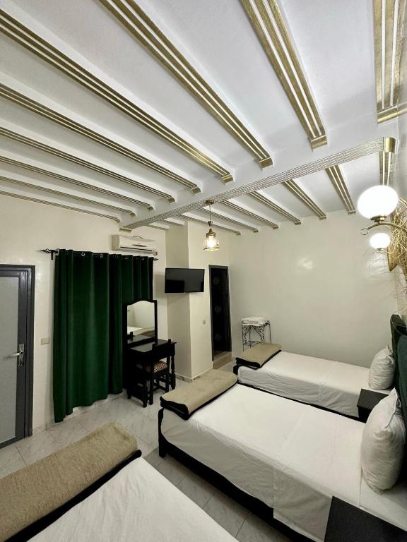 Postel nebo postele na pokoji v ubytování Hôtel Zaghro