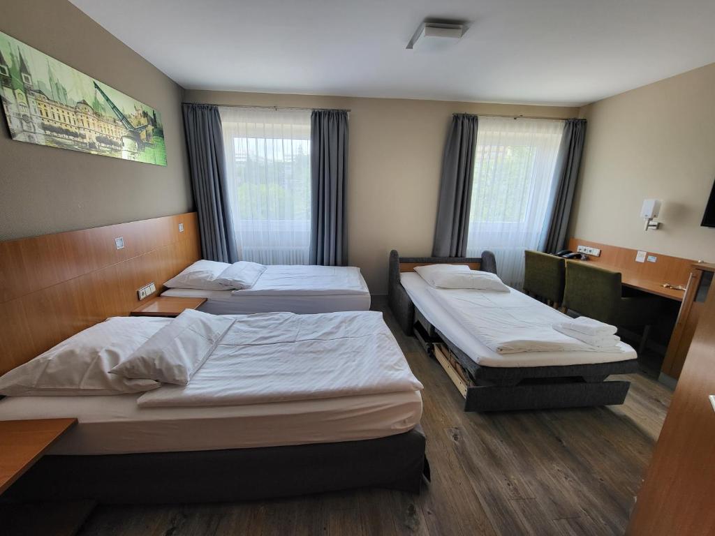 Postel nebo postele na pokoji v ubytování Hotel Lindleinsmühle