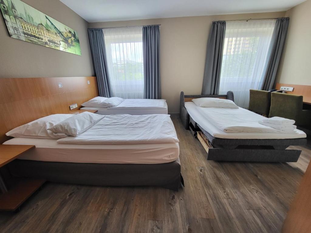 Postel nebo postele na pokoji v ubytování Hotel Lindleinsmühle