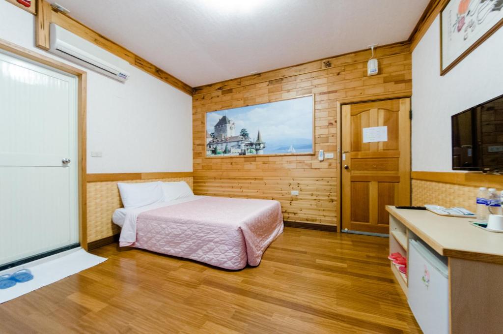 Postel nebo postele na pokoji v ubytování Donglifang B&B