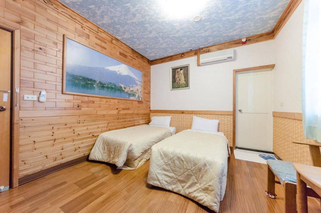 Postel nebo postele na pokoji v ubytování Donglifang B&B