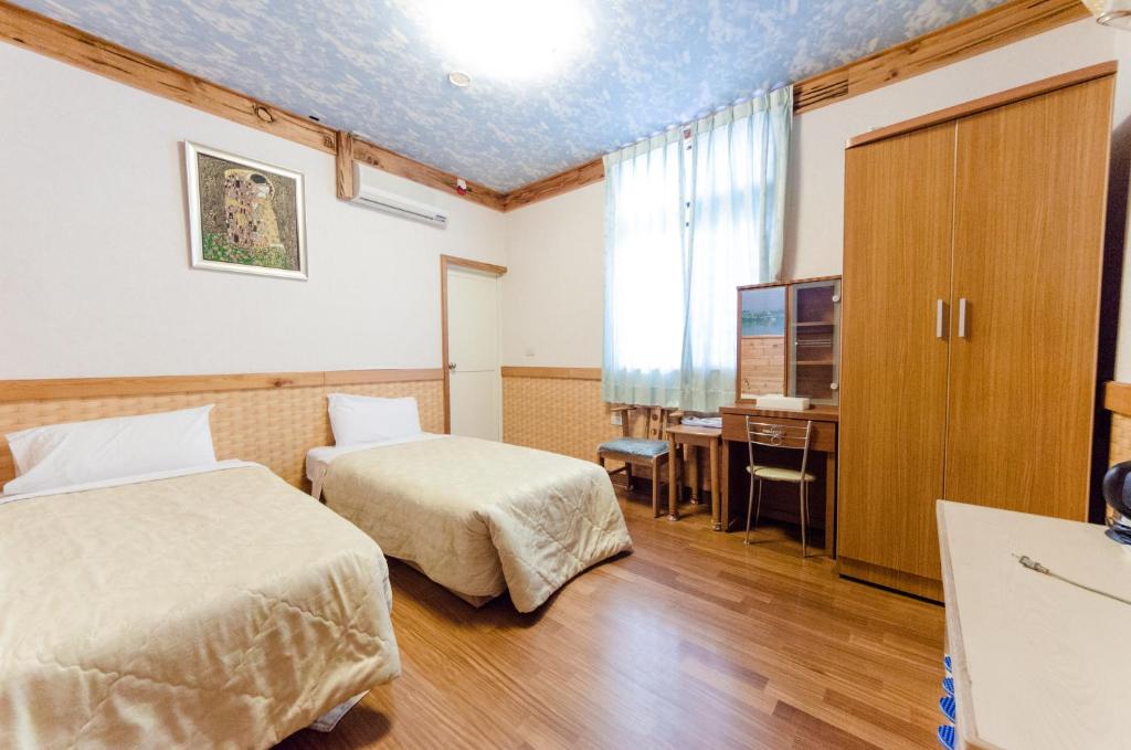 Postel nebo postele na pokoji v ubytování Donglifang B&B