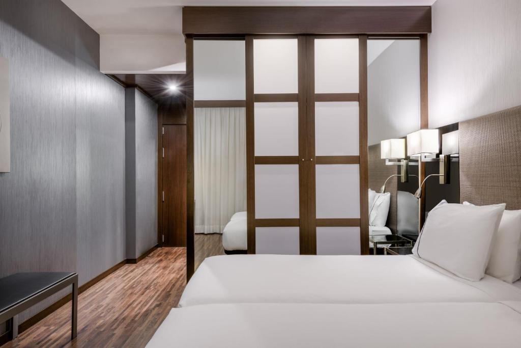 Postel nebo postele na pokoji v ubytování AC Hotel Brescia by Marriott