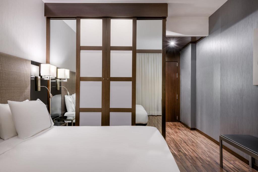 Postel nebo postele na pokoji v ubytování AC Hotel Brescia by Marriott