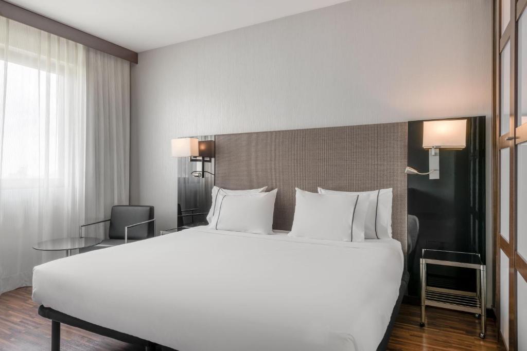 Postel nebo postele na pokoji v ubytování AC Hotel Brescia by Marriott