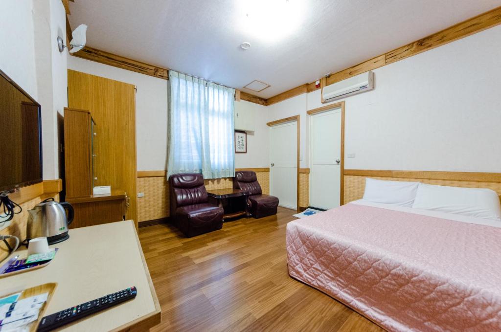 Postel nebo postele na pokoji v ubytování Donglifang B&B