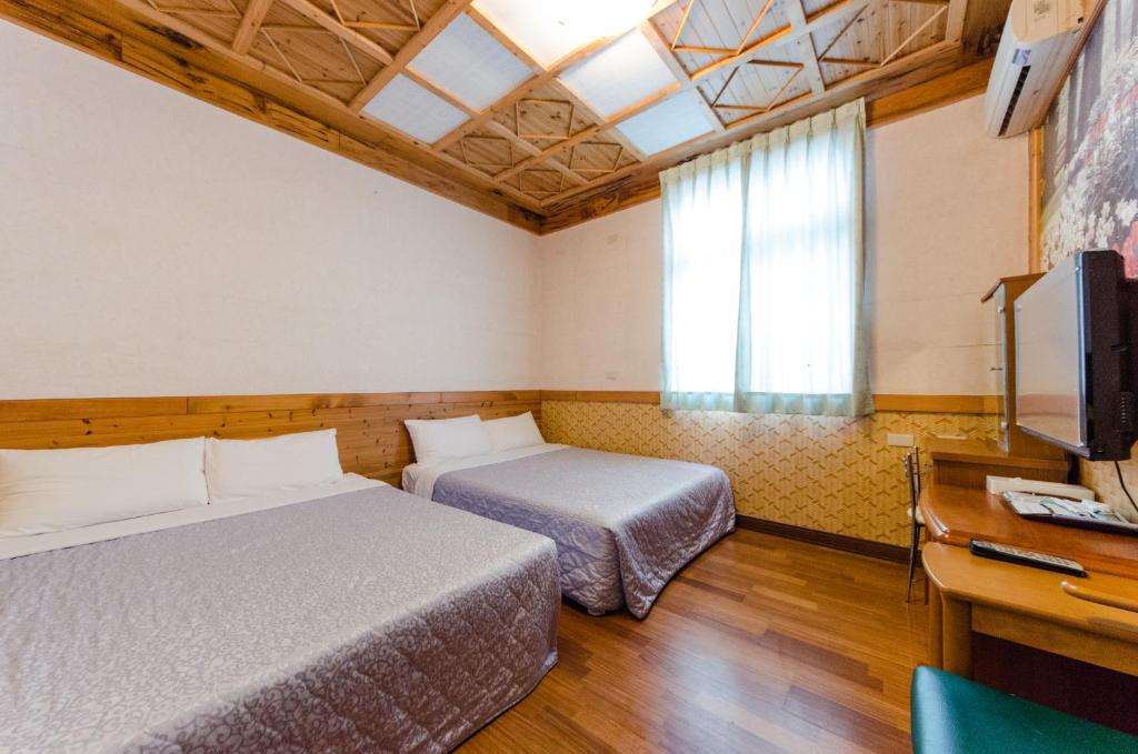 Postel nebo postele na pokoji v ubytování Donglifang B&B