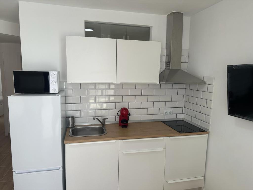 Η κουζίνα ή μικρή κουζίνα στο Antonio Apartment