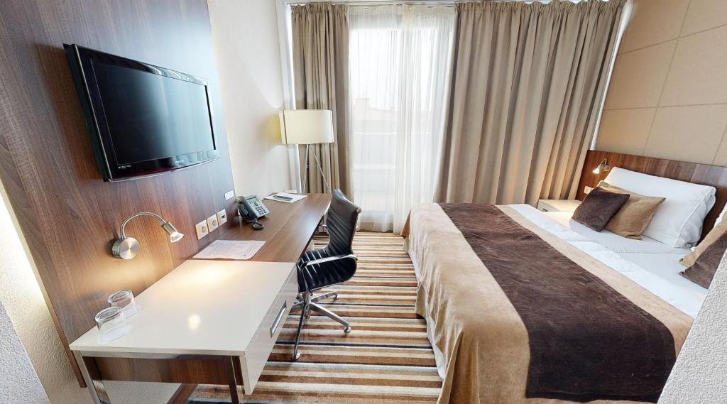 TV a/nebo společenská místnost v ubytování Business Hotel Astrum Laus