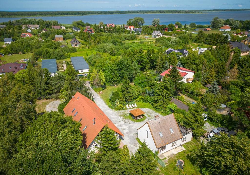 an aerial view of a house with a river at APARTAMENTY STODOŁA in Jezierzany