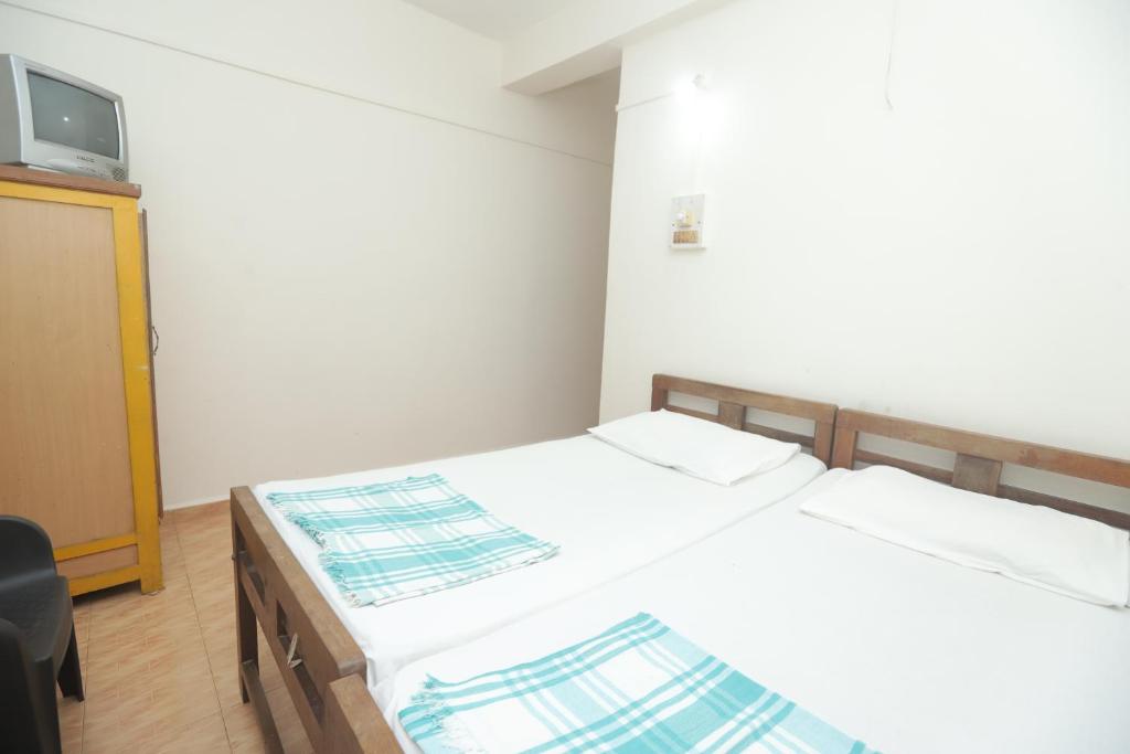 Postel nebo postele na pokoji v ubytování Pritams Cottages Guest House