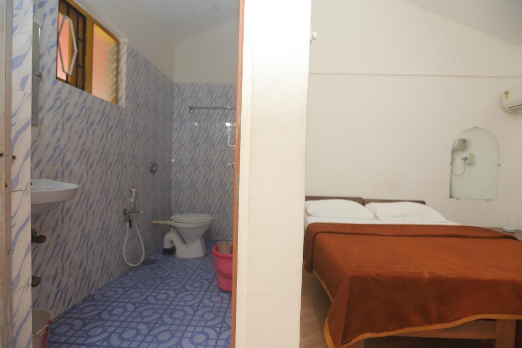 Postel nebo postele na pokoji v ubytování Pritams Cottages Guest House