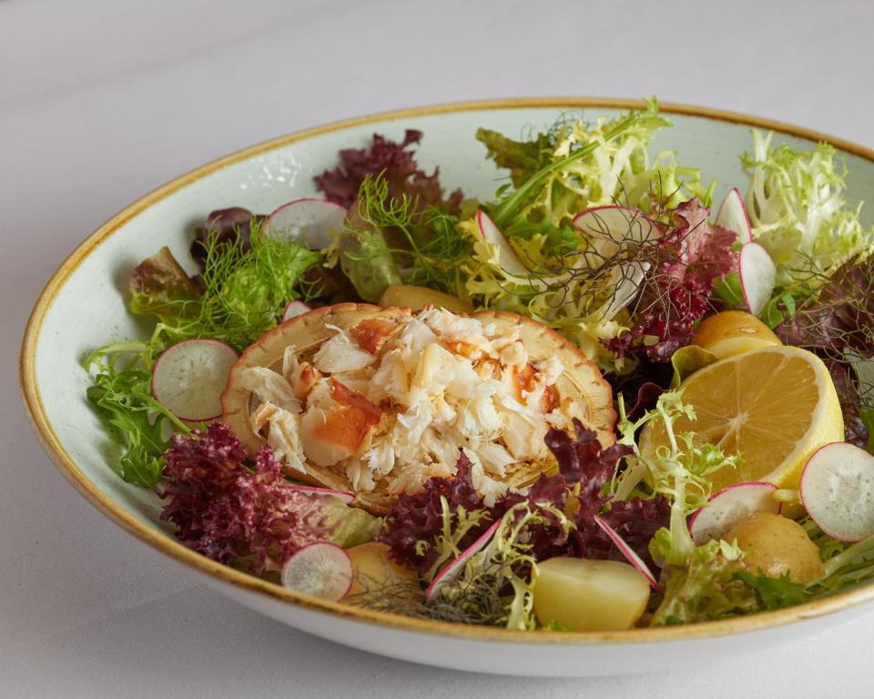 a salad in a bowl on a table at Wentworth Hotel in Aldeburgh