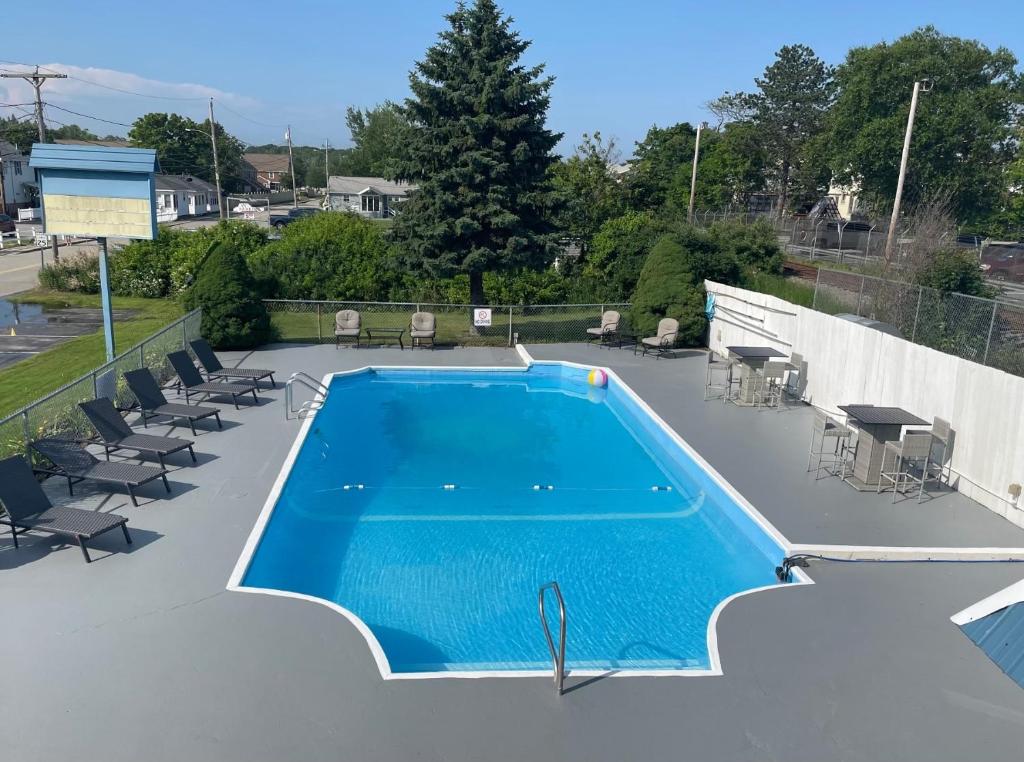 a swimming pool on the roof of a house at Seabreeze Motel in Old Orchard Beach