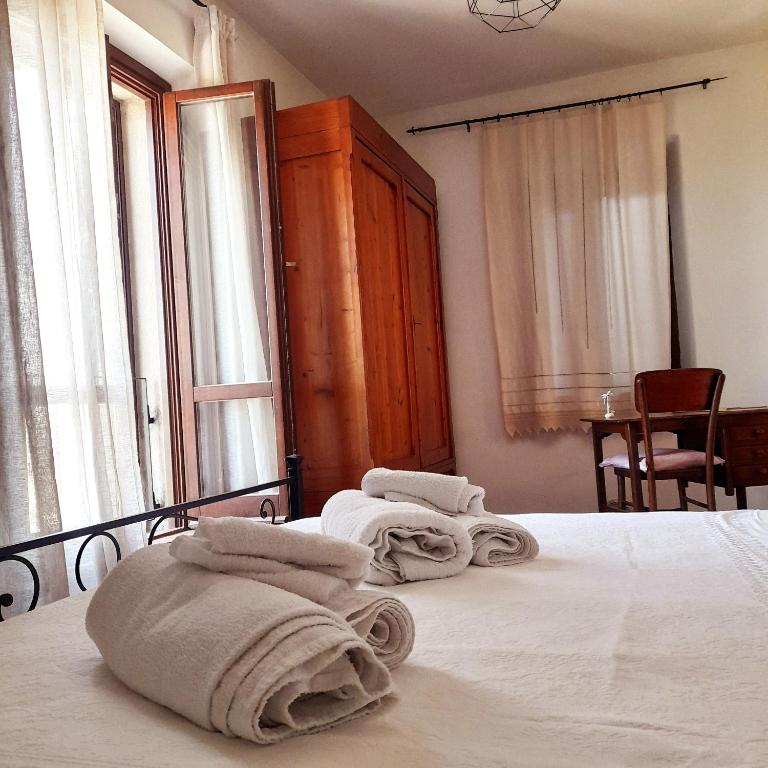 Postel nebo postele na pokoji v ubytování Il vecchio frantoio